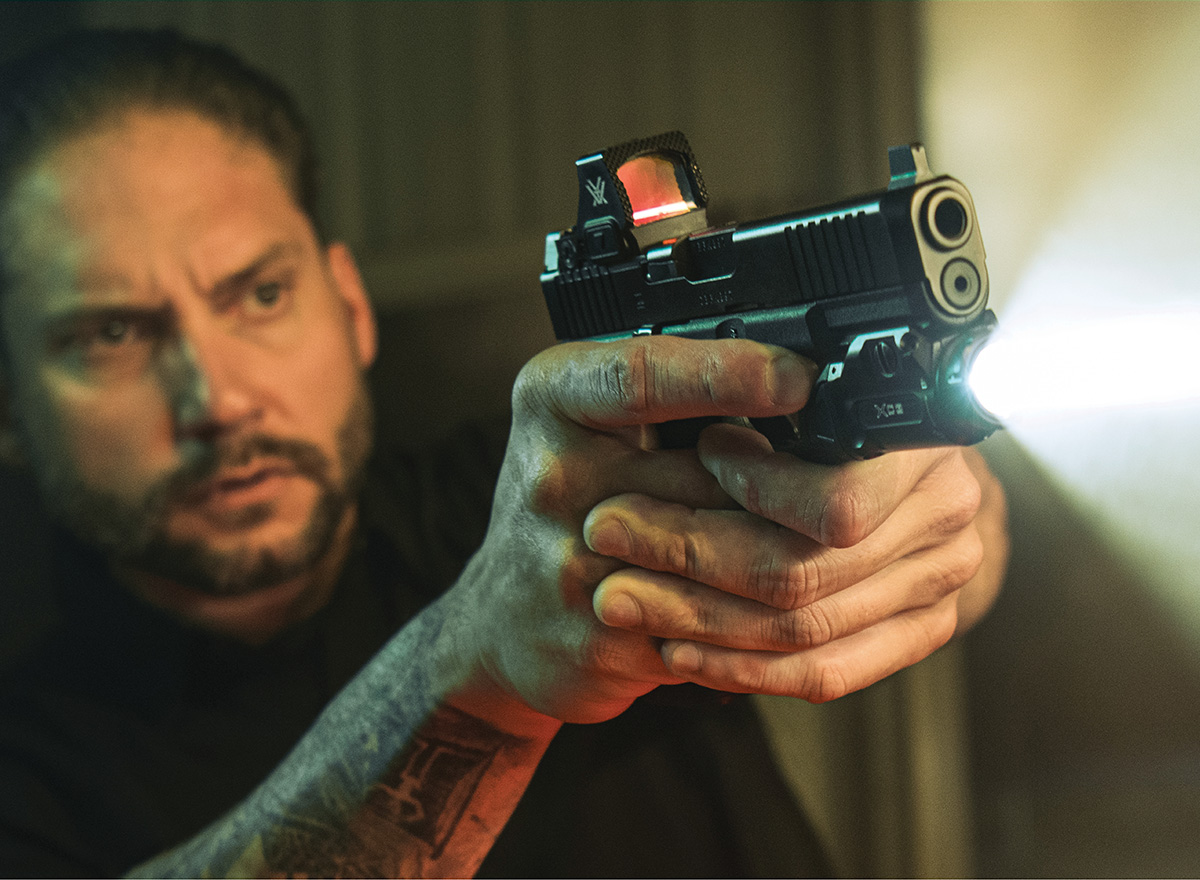 Man holding XC3 mounted handgun